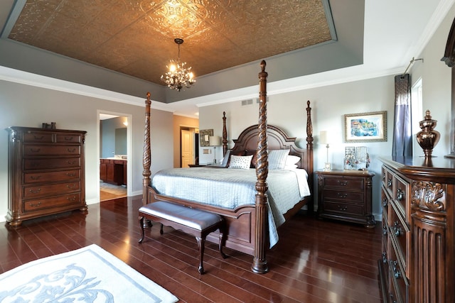 bedroom featuring an ornate ceiling, a raised ceiling, ornamental molding, and dark wood-style floors