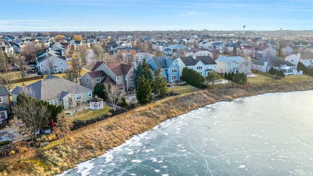 bird's eye view with a water view and a residential view