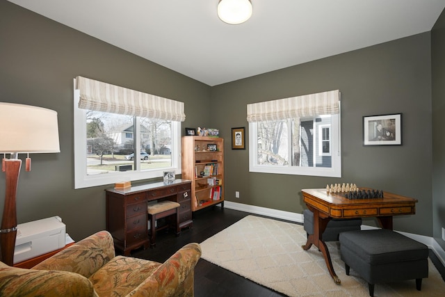 office featuring plenty of natural light and dark hardwood / wood-style floors