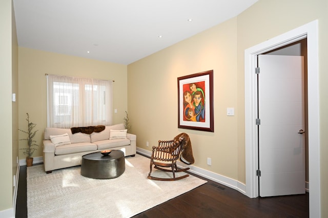 living room with dark hardwood / wood-style floors