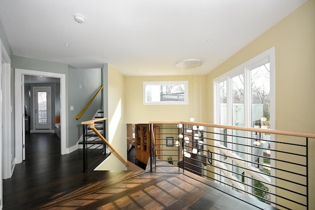 corridor featuring dark hardwood / wood-style floors