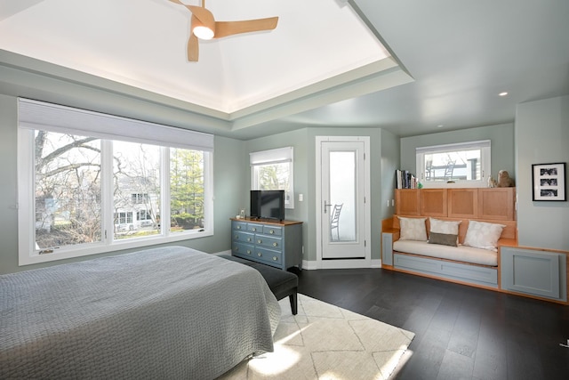 bedroom featuring ceiling fan, access to exterior, and dark hardwood / wood-style flooring