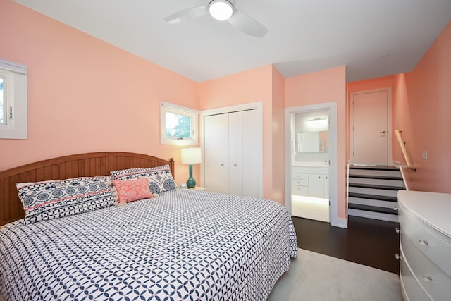 bedroom with ceiling fan, wood-type flooring, and a closet