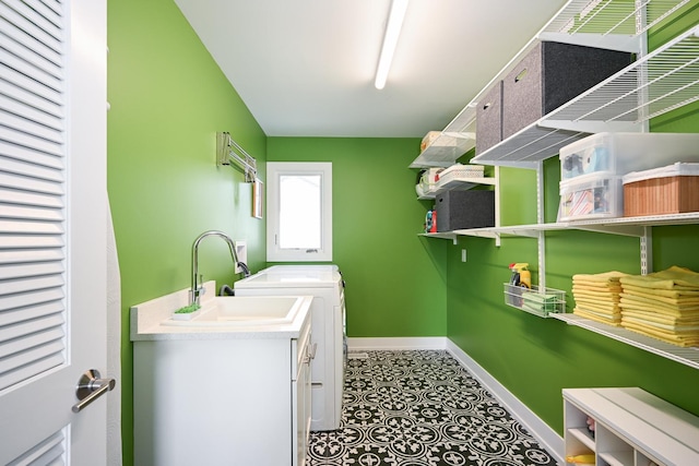 laundry area with sink and independent washer and dryer