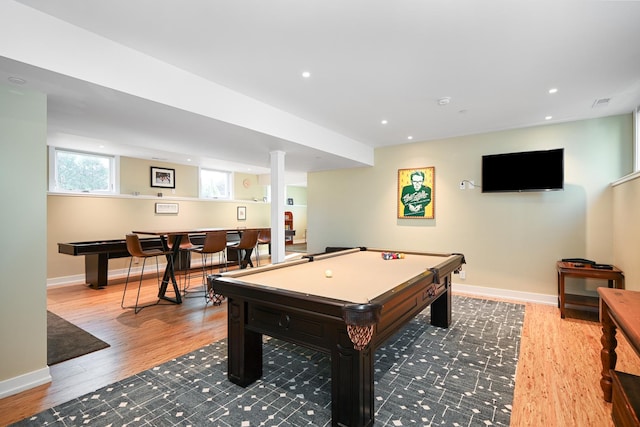 game room featuring wood-type flooring, bar area, and billiards