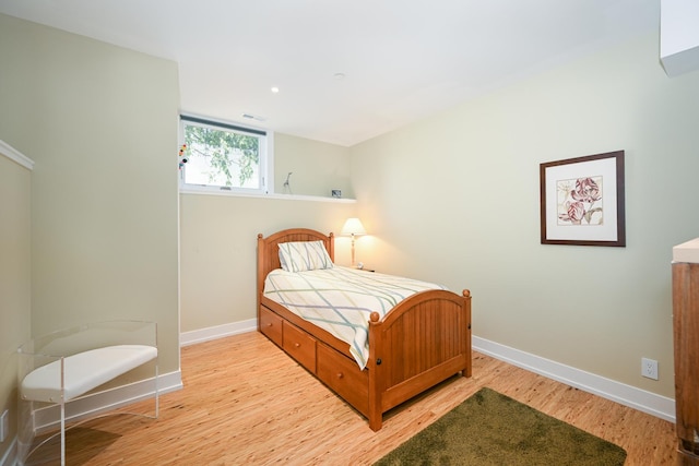 bedroom featuring light wood-type flooring