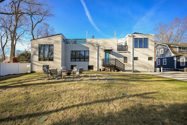 rear view of property featuring a yard