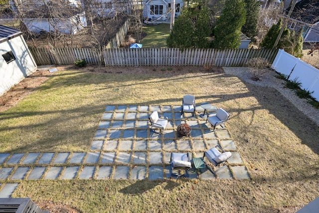 view of yard featuring a patio area and a fire pit