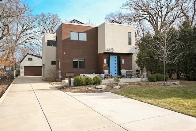 modern home with a garage and a front yard