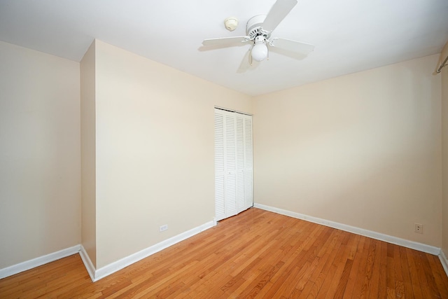 unfurnished room with ceiling fan and light hardwood / wood-style floors