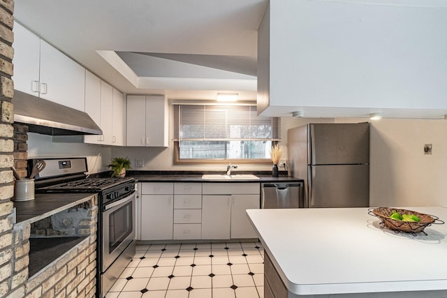 kitchen with appliances with stainless steel finishes, sink, and white cabinets