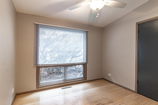 empty room featuring ceiling fan and light hardwood / wood-style floors