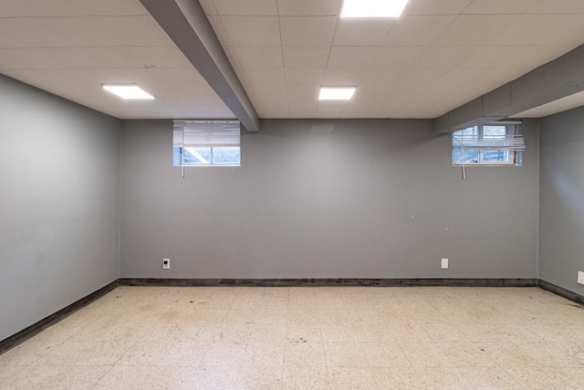 basement featuring a drop ceiling