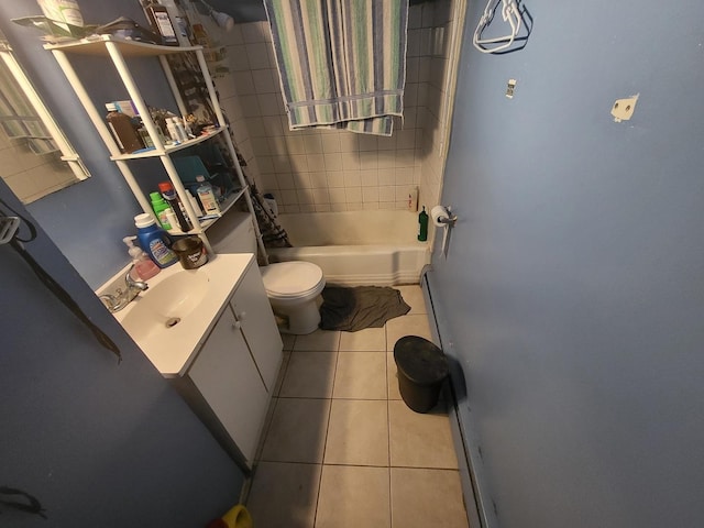 full bathroom featuring vanity, shower / tub combo with curtain, tile patterned floors, and toilet