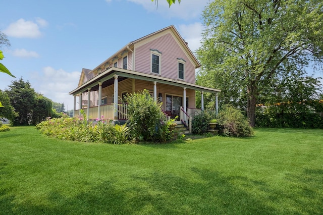 exterior space with covered porch and a lawn