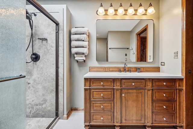 bathroom featuring tile patterned floors, vanity, and an enclosed shower