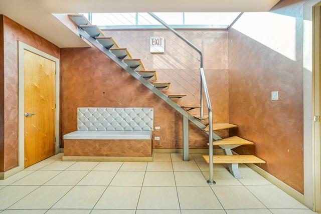 staircase featuring tile patterned floors