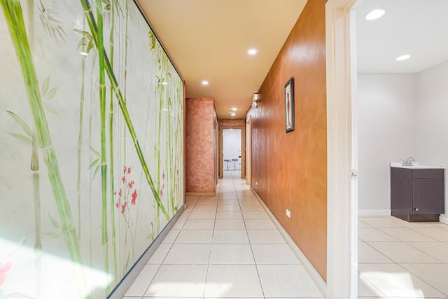 hallway featuring light tile patterned floors