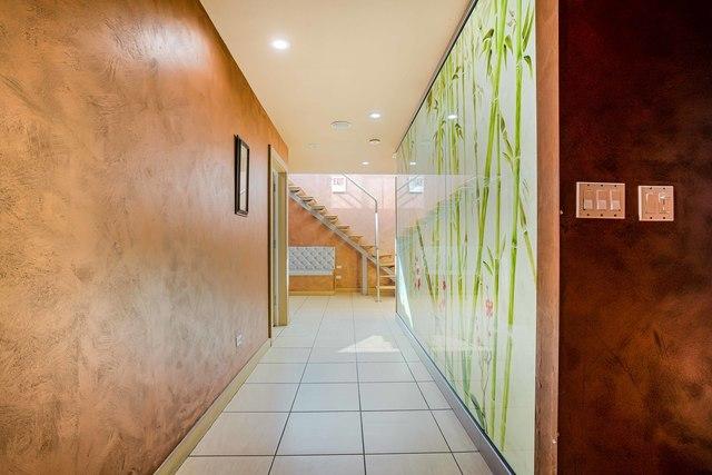 hallway featuring light tile patterned flooring