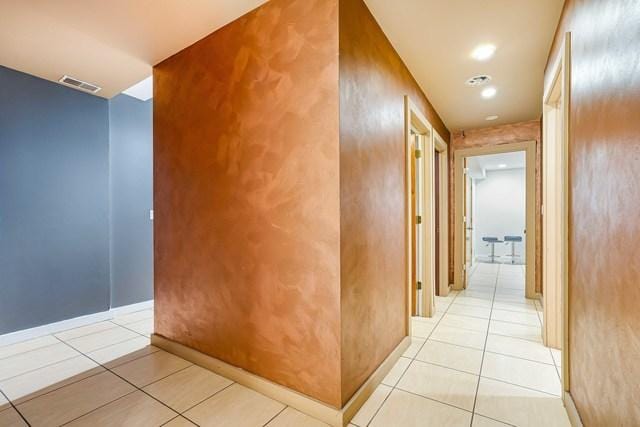 corridor with light tile patterned floors