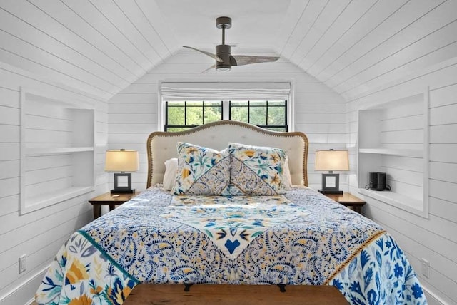 bedroom featuring ceiling fan, lofted ceiling, and wood walls