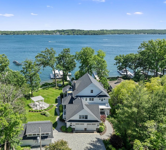 birds eye view of property with a water view