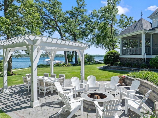 view of patio / terrace featuring a pergola, a fire pit, and a water view