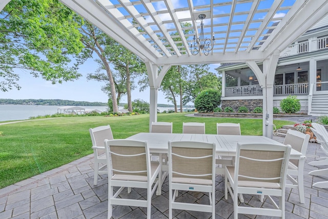 view of patio / terrace with a water view, a sunroom, ceiling fan, and a pergola