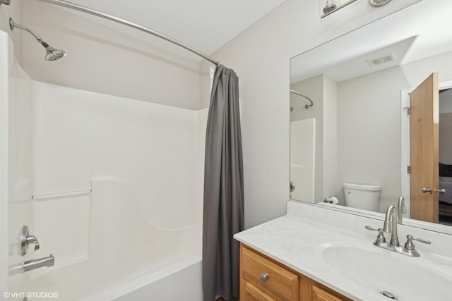 full bathroom with toilet, vanity, and shower / bathtub combination with curtain