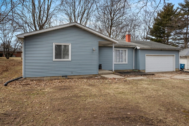 ranch-style home with driveway, a chimney, an attached garage, and roof with shingles