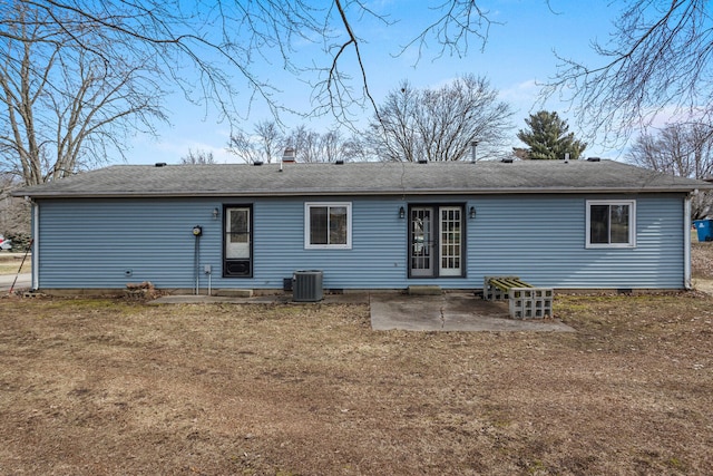 back of property featuring a patio, central air condition unit, crawl space, roof with shingles, and a chimney