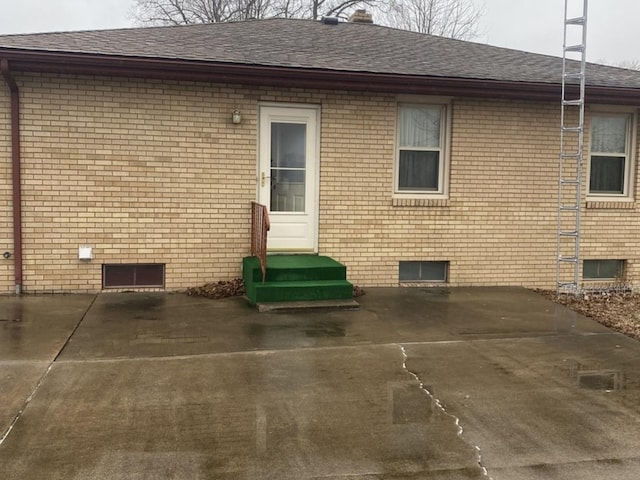 rear view of property featuring a patio