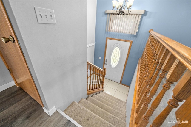 foyer entrance with a chandelier