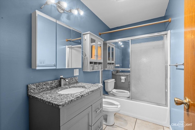 full bathroom featuring tile patterned flooring, vanity, shower / bath combination with glass door, and toilet