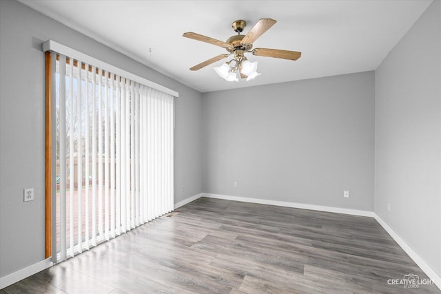 spare room with ceiling fan and hardwood / wood-style floors