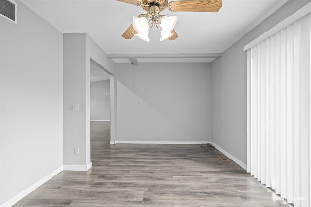 empty room featuring hardwood / wood-style flooring and ceiling fan