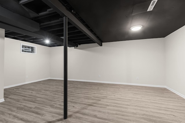 basement with wood-type flooring