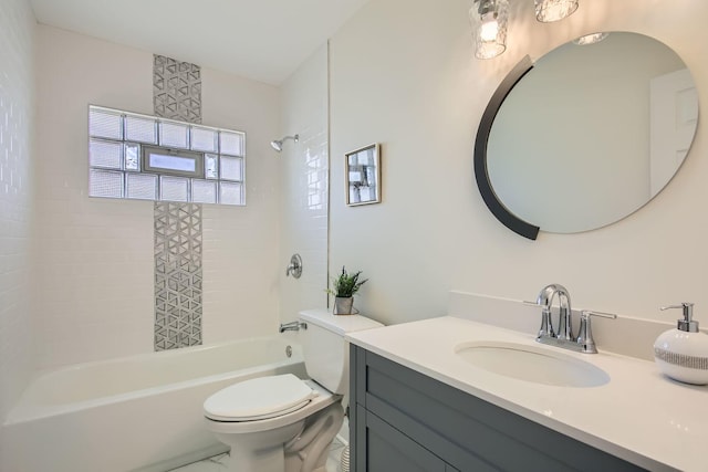 full bathroom with vanity, toilet, and tiled shower / bath combo