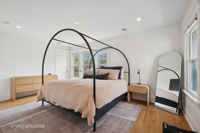 2645 Prairie Ave, Evanston, IL 60201 - bedroom with light wood finished floors, baseboards, and visible vents