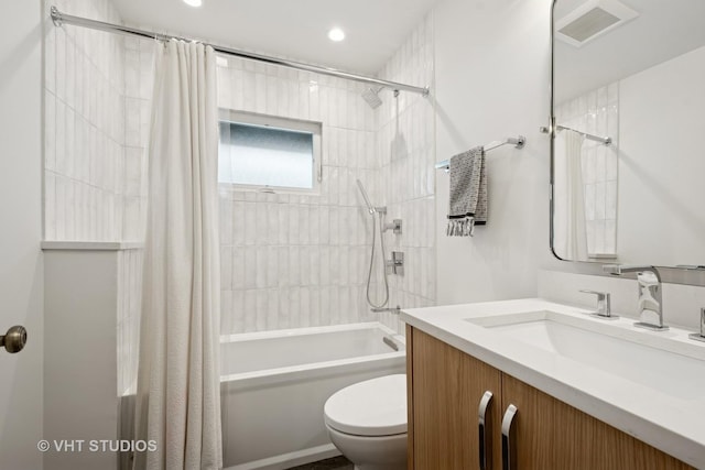 2645 Prairie Ave, Evanston, IL 60201 - bathroom featuring toilet, shower / bath combo, visible vents, and vanity