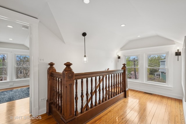 2645 Prairie Ave, Evanston, IL 60201 - hall featuring lofted ceiling, baseboards, visible vents, hardwood / wood-style floors, and an upstairs landing