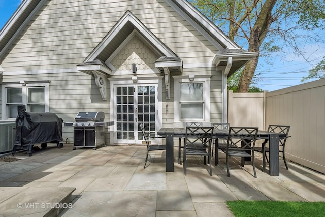 2645 Prairie Ave, Evanston, IL 60201 - rear view of property featuring a patio, french doors, fence, and outdoor dining space