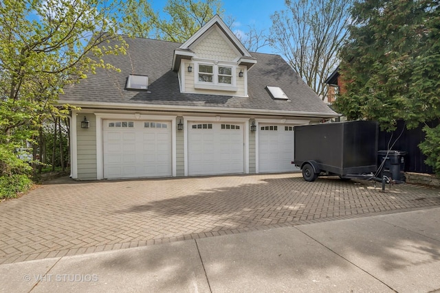 2645 Prairie Ave, Evanston, IL 60201 - garage featuring decorative driveway
