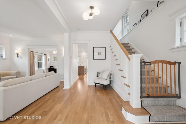 2645 Prairie Ave, Evanston, IL 60201 - interior space featuring baseboards, stairs, ornamental molding, and light wood-type flooring