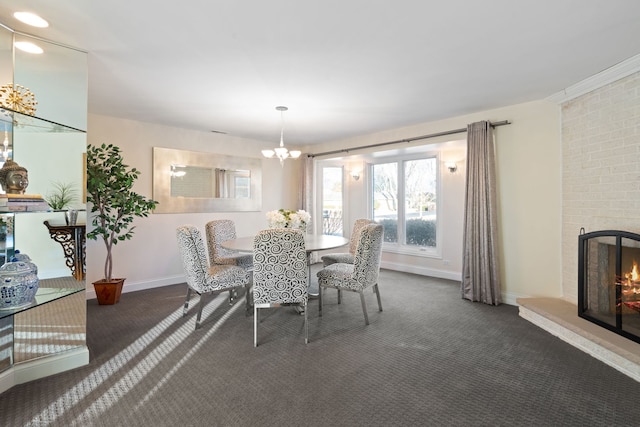 carpeted dining area with a fireplace and a chandelier