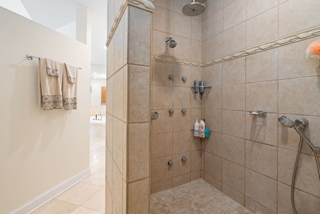 bathroom with tile patterned floors and tiled shower