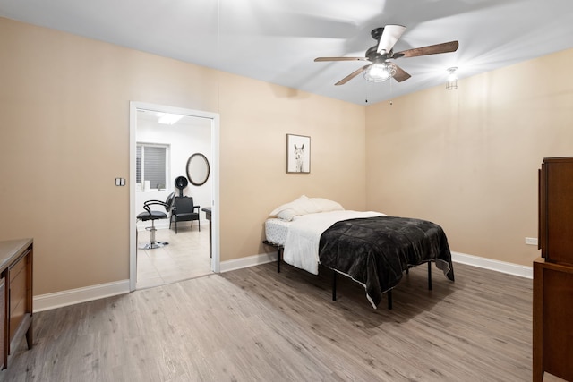 bedroom featuring light hardwood / wood-style flooring and ceiling fan