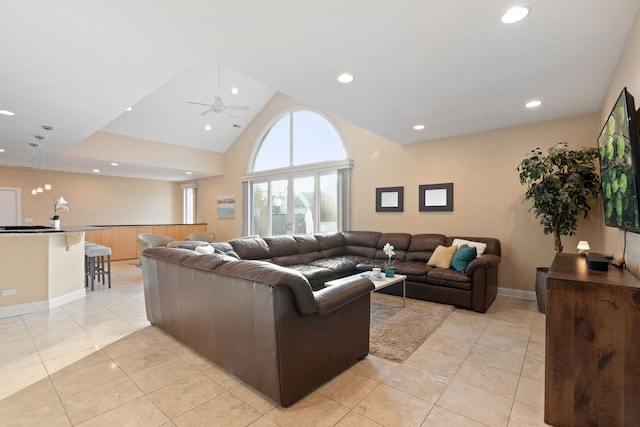 living room with high vaulted ceiling, ceiling fan, and light tile patterned flooring