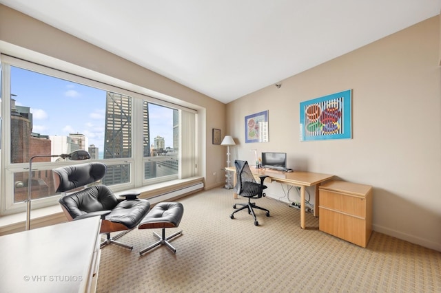 carpeted office space featuring lofted ceiling