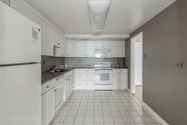 175 E Delaware Pl Unit 4503, Chicago, IL 60611 - kitchen featuring white appliances, white cabinetry, dark stone countertops, and light tile patterned floors